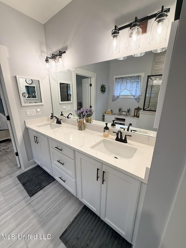 2290 Loisy Blvd, Hernando, MS 38632 - bathroom with double vanity and a shower stall