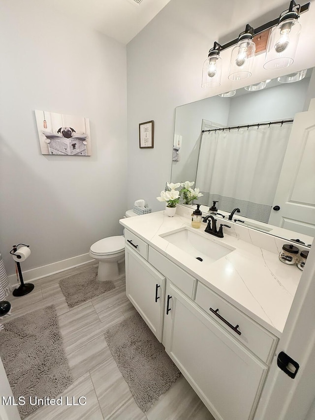 2290 Loisy Blvd, Hernando, MS 38632 - full bath with vanity, baseboards, toilet, and curtained shower