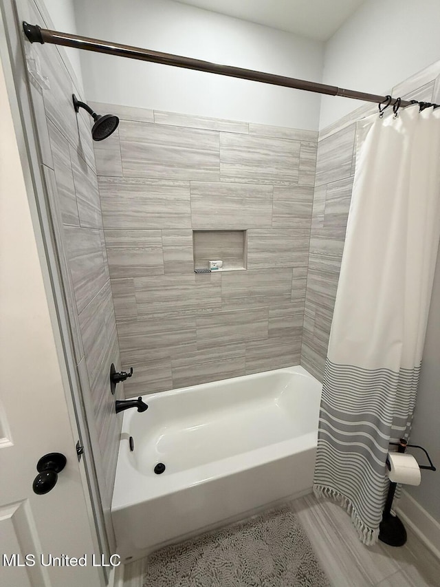 2290 Loisy Blvd, Hernando, MS 38632 - bathroom with shower / bathtub combination with curtain