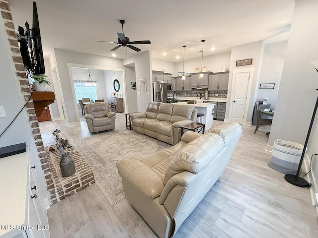 2290 Loisy Blvd, Hernando, MS 38632 - living area featuring a ceiling fan, light wood-style flooring, a chandelier, recessed lighting, and baseboards