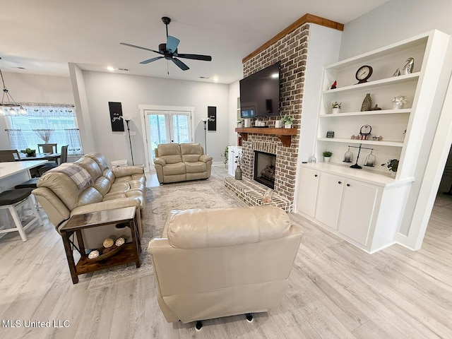 2290 Loisy Blvd, Hernando, MS 38632 - living room with ceiling fan, light wood-style floors, and a brick fireplace
