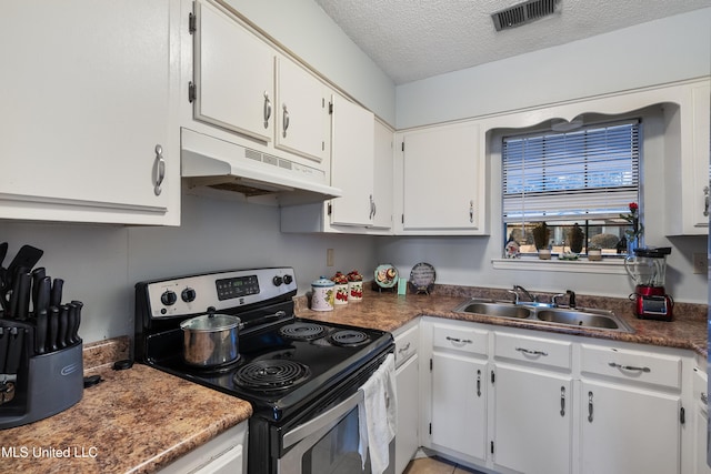 kitchen featuring white cabinetry, stainless steel electric range oven, sink, and a textured ceiling