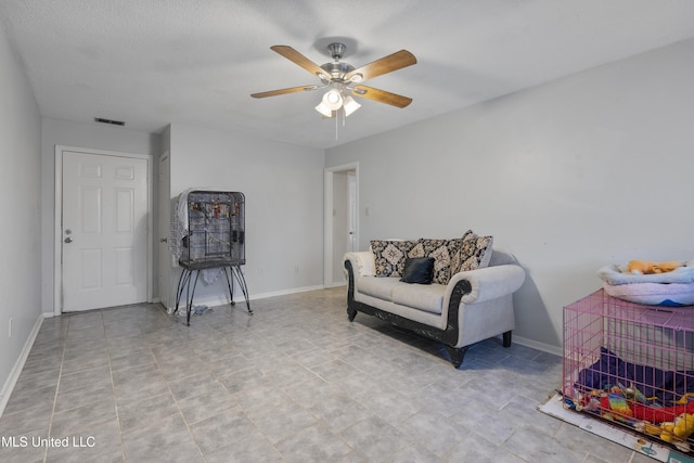 living area featuring ceiling fan