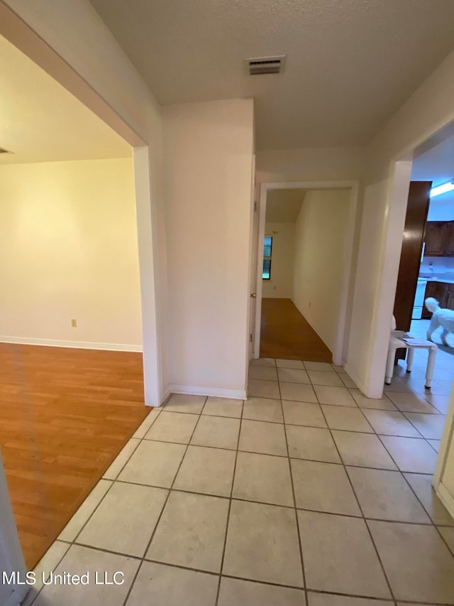 hallway with light wood-type flooring