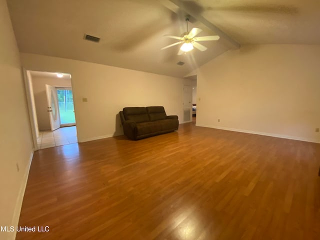 unfurnished room featuring vaulted ceiling with beams, wood-type flooring, and ceiling fan