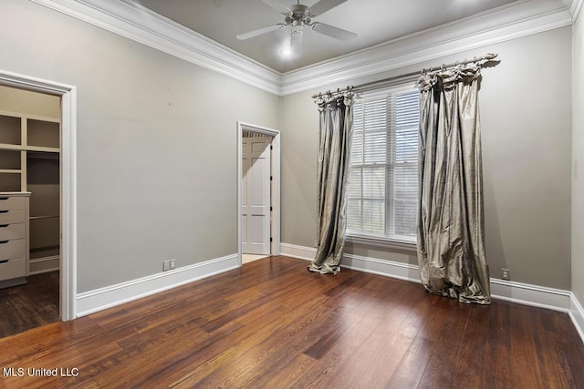 spare room with crown molding, ceiling fan, and dark hardwood / wood-style floors