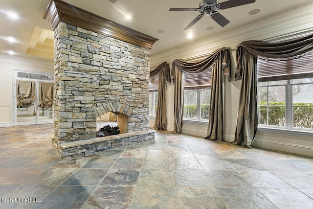 unfurnished living room with ceiling fan, ornamental molding, and a stone fireplace