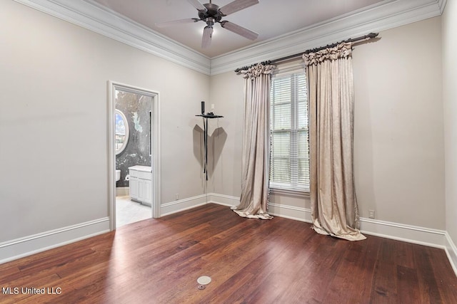 spare room with hardwood / wood-style floors, ornamental molding, and ceiling fan