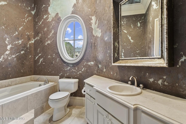 bathroom featuring a relaxing tiled tub, vanity, toilet, and tile patterned flooring