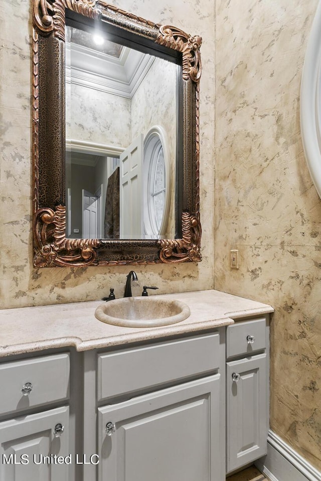 bathroom with vanity and crown molding