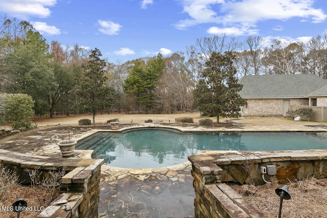 view of swimming pool featuring a patio