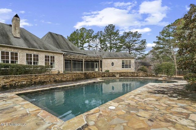 view of pool featuring a patio area