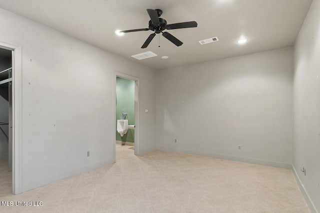 spare room featuring ceiling fan