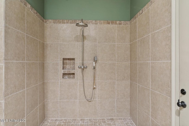 bathroom with a tile shower