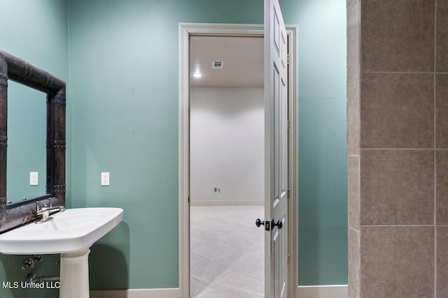 bathroom with tile patterned flooring