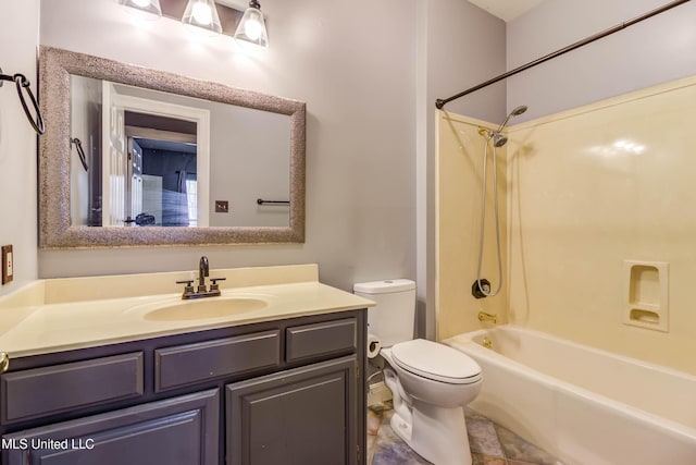 bathroom featuring shower / bathtub combination, vanity, and toilet