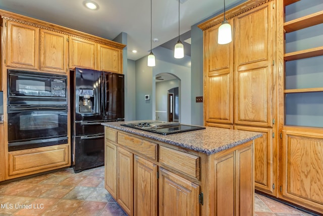 kitchen with arched walkways, pendant lighting, a center island, stone countertops, and black appliances