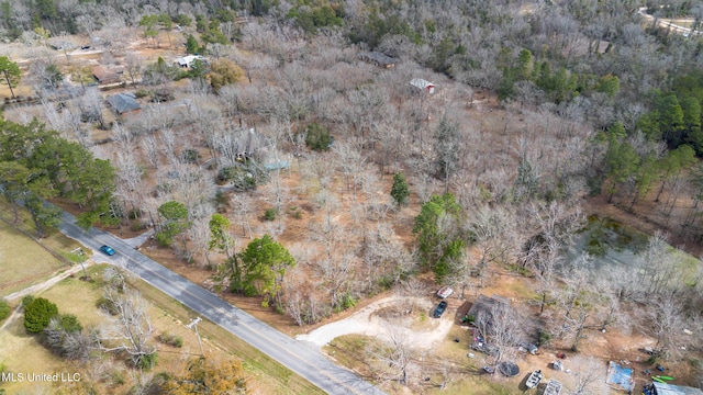 drone / aerial view with a view of trees