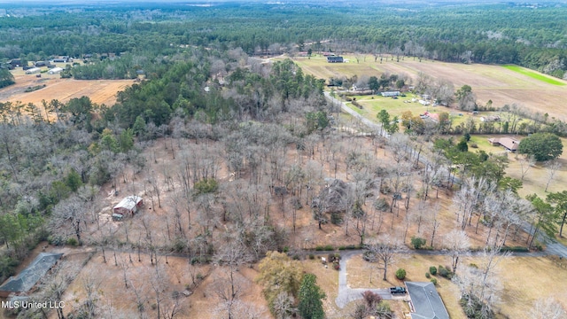 birds eye view of property with a rural view and a view of trees