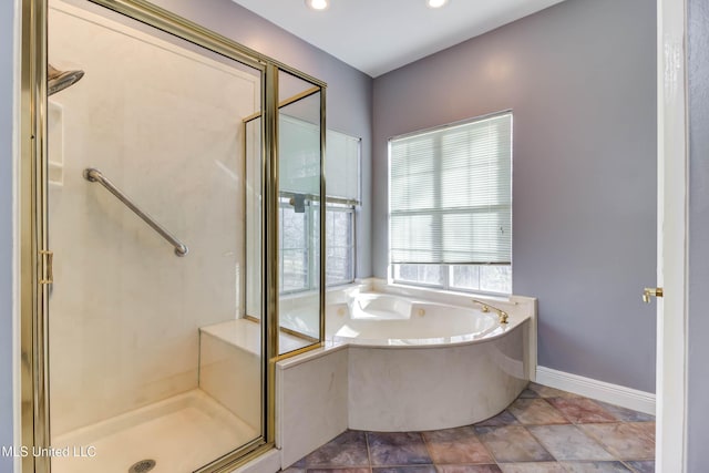 full bathroom featuring a stall shower, baseboards, a garden tub, and recessed lighting