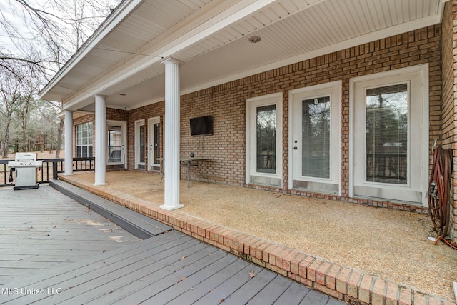 wooden terrace with grilling area