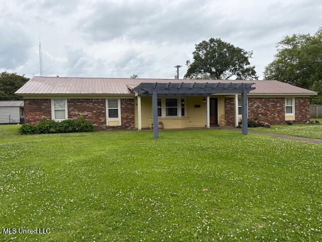 3 Pemberton Cir, Greenwood, MS 38930 - ranch-style home with a pergola, a front lawn, and metal roof