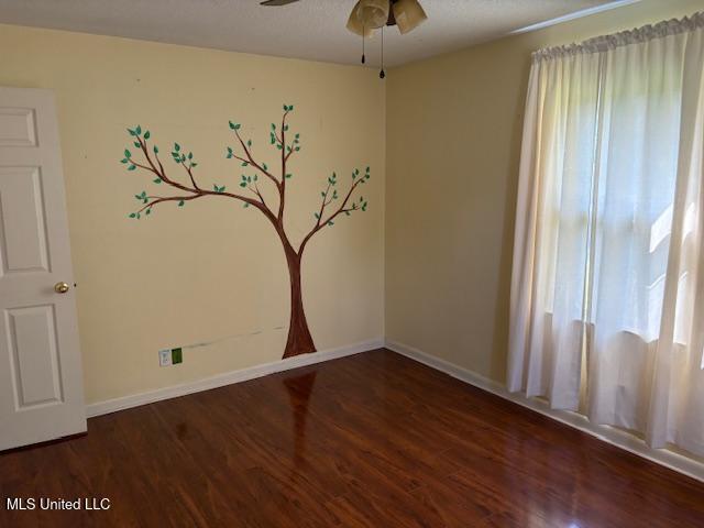 3 Pemberton Cir, Greenwood, MS 38930 - empty room with wood finished floors, baseboards, and a ceiling fan