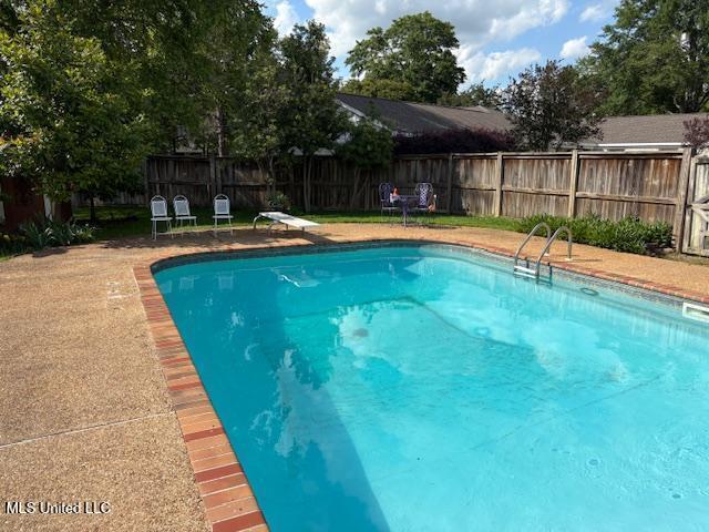 3 Pemberton Cir, Greenwood, MS 38930 - view of pool with a fenced backyard and a diving board
