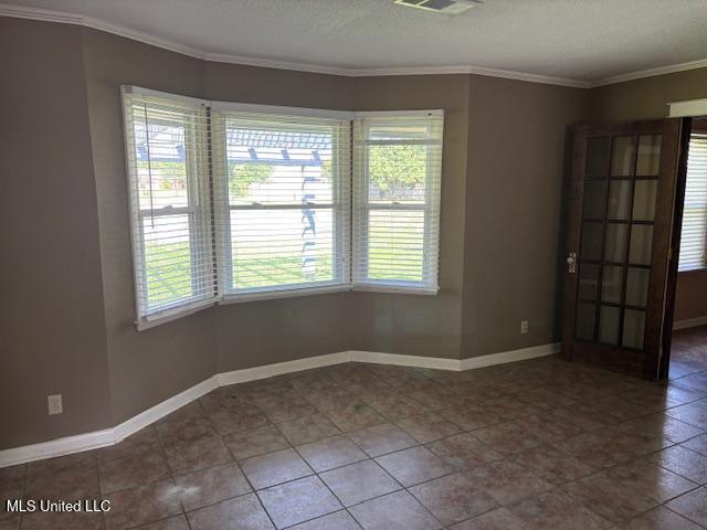 3 Pemberton Cir, Greenwood, MS 38930 - spare room with crown molding and baseboards