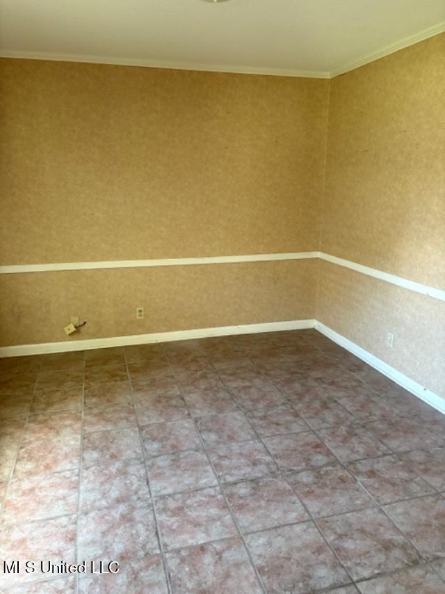 3 Pemberton Cir, Greenwood, MS 38930 - spare room featuring crown molding