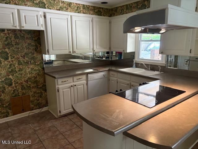 3 Pemberton Cir, Greenwood, MS 38930 - kitchen featuring ventilation hood, dishwasher, a sink, wallpapered walls, and white cabinets