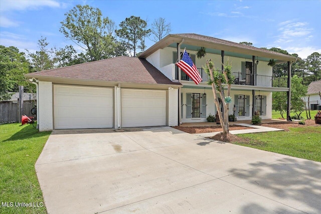 110 Stonington Ct, Brandon, MS 39047 - view of front of house with brick siding, driveway, covered porch, an attached garage, and a balcony