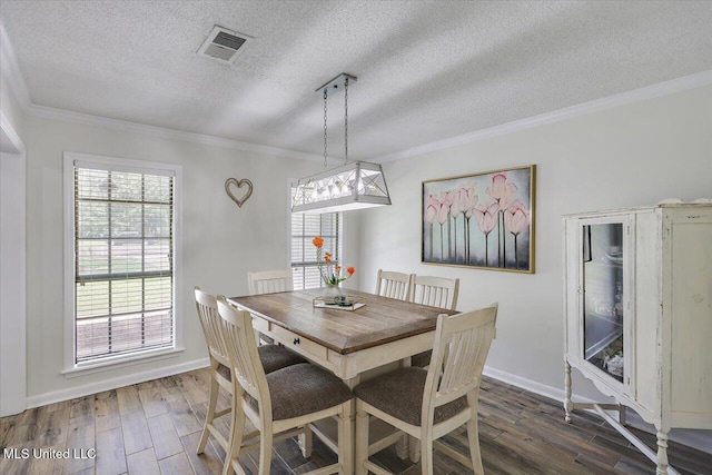110 Stonington Ct, Brandon, MS 39047 - dining space with dark wood finished floors, ornamental molding, and a textured ceiling