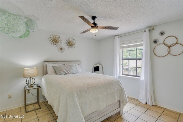 110 Stonington Ct, Brandon, MS 39047 - bedroom with light tile patterned floors, a textured ceiling, and ceiling fan