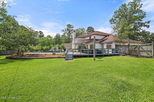 110 Stonington Ct, Brandon, MS 39047 - fenced backyard featuring a wooden deck