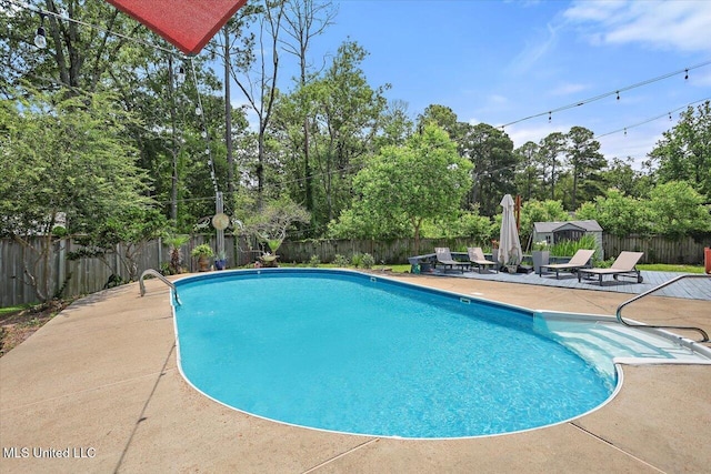 110 Stonington Ct, Brandon, MS 39047 - view of swimming pool with a patio area, a fenced backyard, and view of wooded area