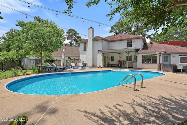 110 Stonington Ct, Brandon, MS 39047 - view of pool with a patio area and a storage shed