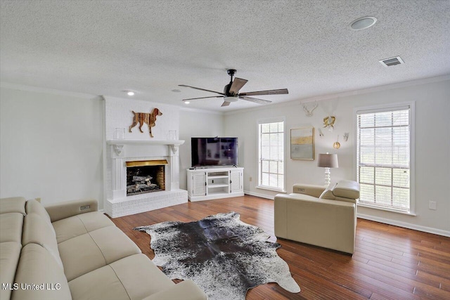 110 Stonington Ct, Brandon, MS 39047 - living room with ornamental molding, a textured ceiling, ceiling fan, plenty of natural light, and wood finished floors