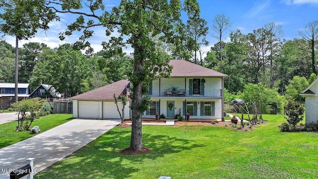 110 Stonington Ct, Brandon, MS 39047 - view of front of home featuring a balcony, a porch, concrete driveway, an attached garage, and view of scattered trees