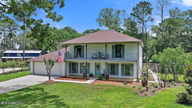 110 Stonington Ct, Brandon, MS 39047 - view of front of property with a porch, a balcony, driveway, an attached garage, and roof with shingles