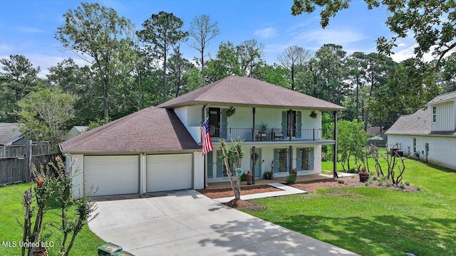 110 Stonington Ct, Brandon, MS 39047 - view of front of home with a porch, a garage, a balcony, concrete driveway, and stucco siding