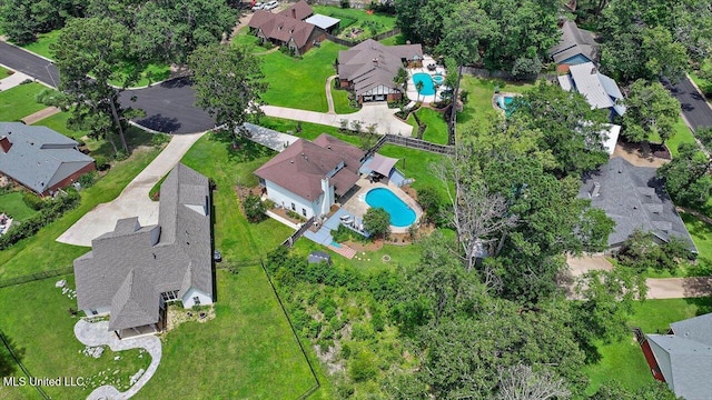 110 Stonington Ct, Brandon, MS 39047 - aerial view of property and surrounding area featuring a pool and nearby suburban area
