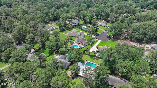 110 Stonington Ct, Brandon, MS 39047 - aerial view of property's location featuring a pool area and nearby suburban area