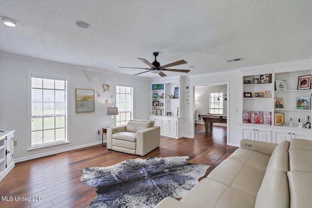 110 Stonington Ct, Brandon, MS 39047 - living room with a textured ceiling, pool table, dark wood finished floors, built in shelves, and crown molding