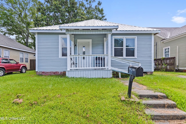 4006 Pine St, Pascagoula, MS 39567 - view of front facade with a metal roof and a porch