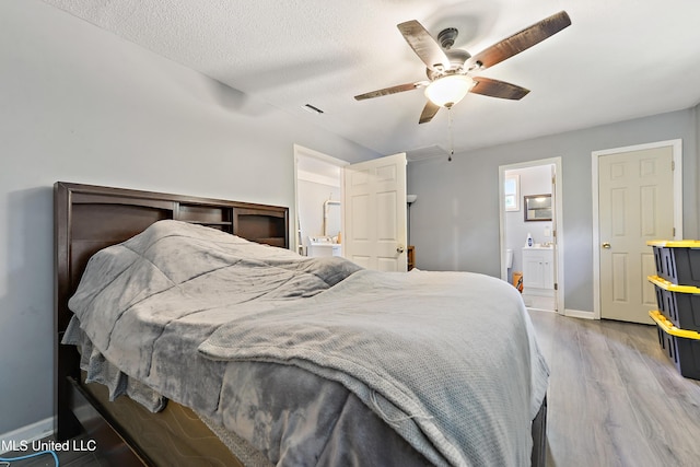 4006 Pine St, Pascagoula, MS 39567 - bedroom with wood finished floors, connected bathroom, and ceiling fan