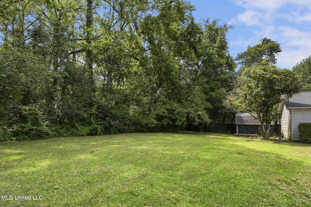 3831 Tyrone Dr, Jackson, MS 39216 - view of grassy yard featuring a shed