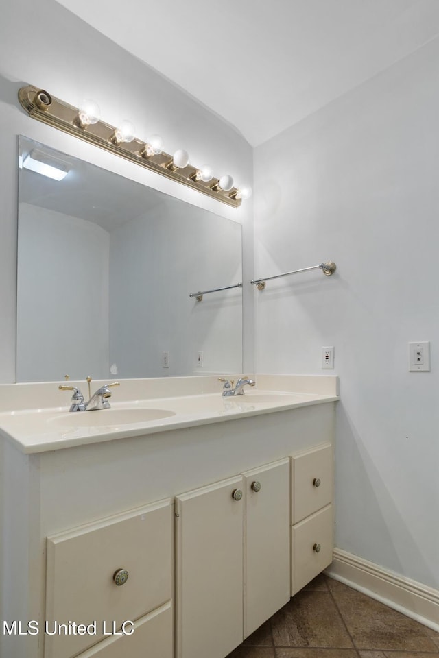 3831 Tyrone Dr, Jackson, MS 39216 - bathroom with double vanity and tile patterned floors