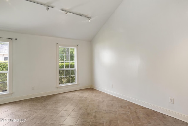 3831 Tyrone Dr, Jackson, MS 39216 - spare room featuring track lighting, lofted ceiling, and healthy amount of natural light