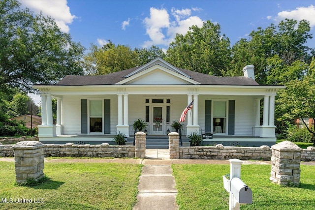 view of front of house featuring a front yard and a porch